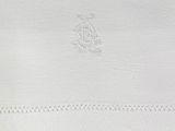 the white towel has a monogram on it and a monogram on it