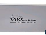 a white box with a black logo on the front of it