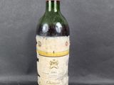 a close up of a bottle of wine sitting on a table