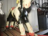a toy horse that is sitting on top of a cart