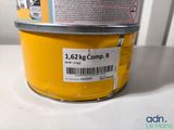 a yellow container with a label on it sitting on a table