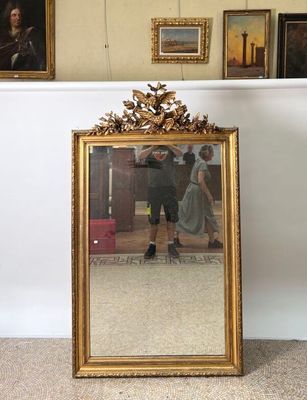 a mirror that is sitting on the floor in front of a mirror