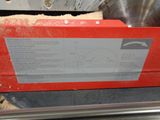 a red box with a label on it sitting on a table