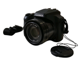 a black digital camera with a lens attached to it