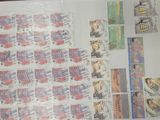 a lot of stamps that are on the table