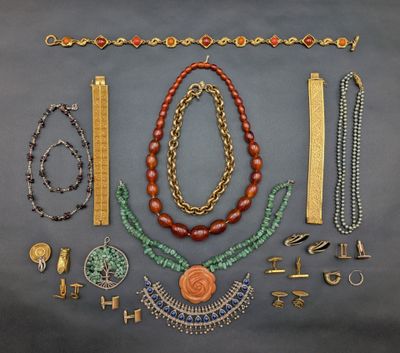 an assortment of jewelry including necklaces, bracelets, and rings