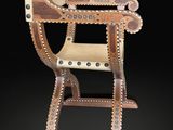 an image of a wooden high chair on a black background