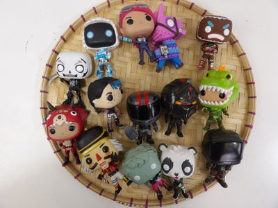 a basket with a bunch of toy figures on it