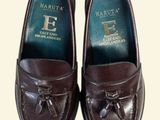 pair of brown leather shoes with tassels on the toes