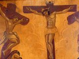 a painting of jesus on the cross on the wall