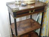 a small table with a tray on top of it next to a window