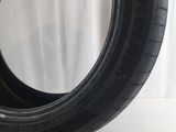 a close up of a tire on a white surface