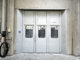 a bike parked in front of a garage door