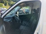the interior of a car with the door open and the driver ' s seat in the passenger seat