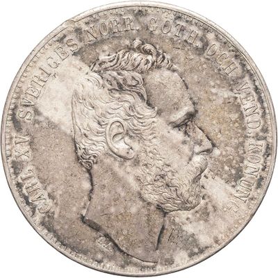 an old silver coin with a man ' s face on it