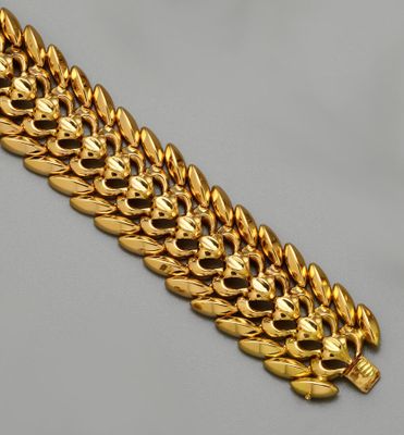 Bracelet en or jaune 18K (750/oo) à large maillons articulés…