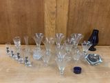 a lot of wine glasses sitting on a table