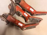 two old rusty pipe cutters sitting on top of a table
