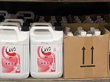 a truck with several containers of liquid on the back of it