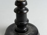 a small globe that is on a stand on a table