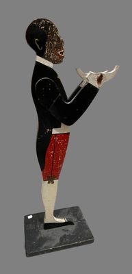 a figurine of a man with a bird in his hand