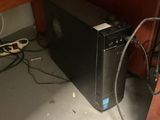 a computer that is sitting on a desk in a room