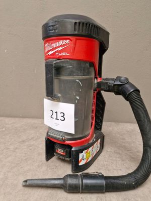 a red and black vacuum cleaner with a hose
