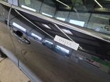 a picture of a car door with a sticker on it
