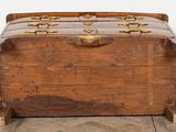 an old trunk sitting on the floor in a room