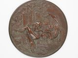 a bronze plaque with a woman and a dog on it