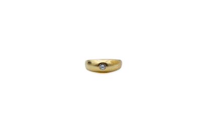 a close up of a gold ring with a diamond on it