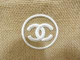 the logo of a chanel bag is shown on a burlock cloth