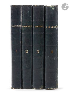 a set of four books sitting on top of each other on a white surface