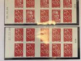 four stamps of different colors and designs on a sheet of paper