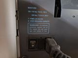 a close up of a person ' s hand touching a button on a machine