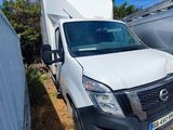 a white van that is parked next to a trailer