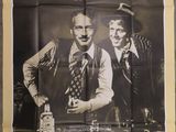 an old movie poster of two men standing next to each other
