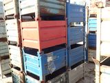 many crates that are stacked on top of each other