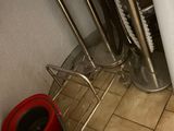 a toilet in the bathroom with a red lid