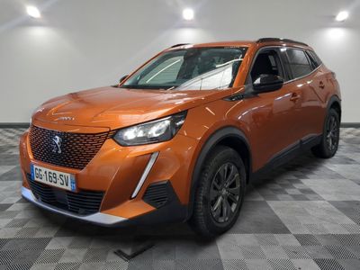 the orange suv is parked in a room with a checkered floor