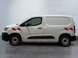 a white van with red stripes parked in a parking lot