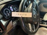 the steering wheel of a car with a sticker on it ' s dashboard