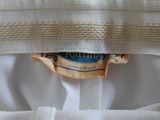 a close up of a white shirt with a label on it