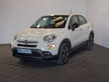 the white fiat suv is parked in a showroom with a checkered floor