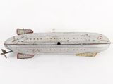 a small toy airplane sitting on top of a white surface