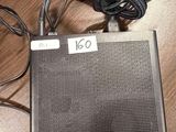 a radio that is sitting on a table next to a keyboard
