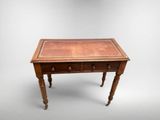 an old wooden table with two drawers and a drawer underneath it