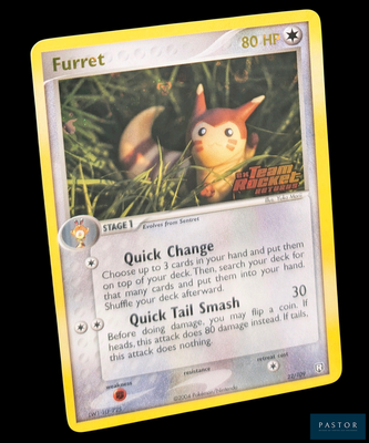 une carte Pokémon représentant un renard dans l'herbe