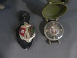 three different types of watches on display on a table