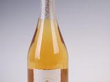 a bottle of wine that is sitting on a table